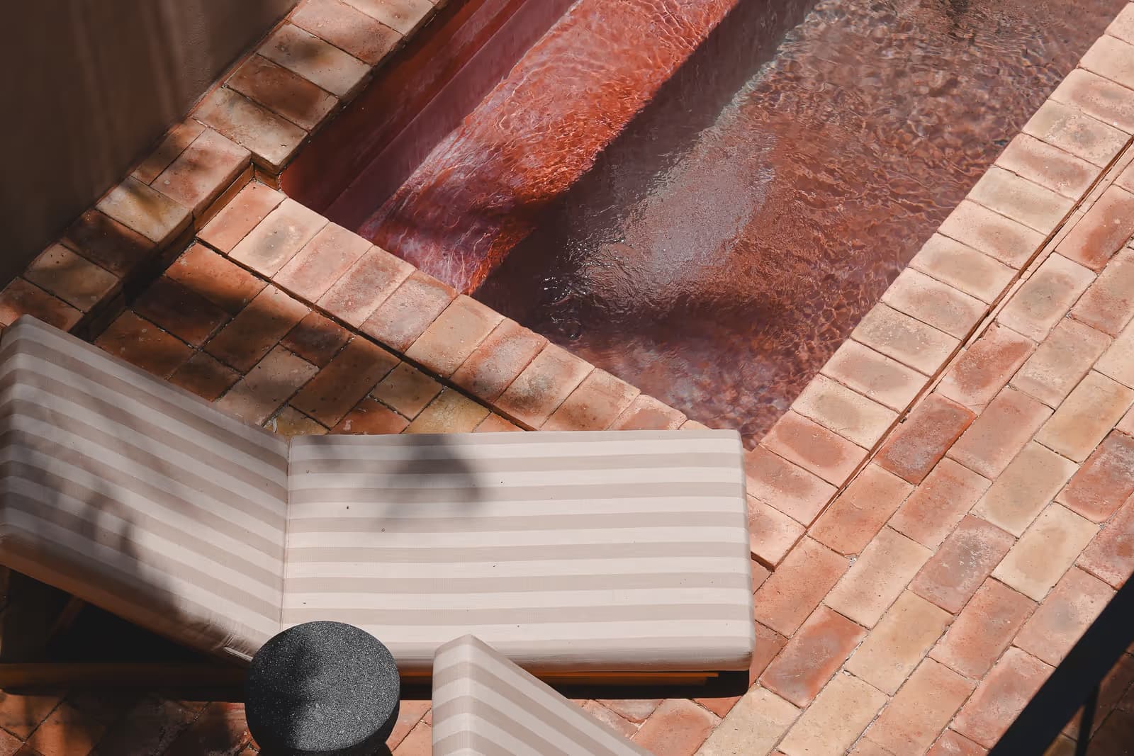Overhead view of a villa private pool with sun loungers